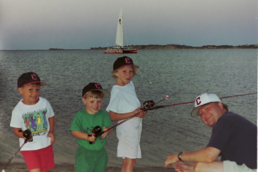 Chris as a boy fishing with his dad and siblings at sunrise